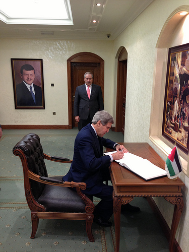 Secretary of State John Kerry signs the guest book at the Ministry of Foreign Affairs in Amman, Jordan on March 23, 2013